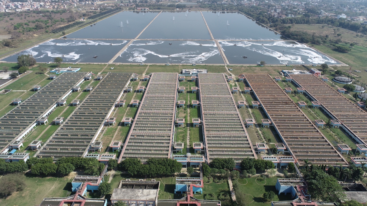 Aerial view of water treatment basins and infrastructure